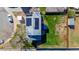 Bird's eye view of the home with solar panels, a deck, a well-manicured lawn, and a fenced backyard at 4465 E 121St Pl, Thornton, CO 80241