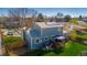 Aerial view of the home showing the well-kept backyard, deck, solar panels and lush landscaping at 4465 E 121St Pl, Thornton, CO 80241