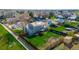 An aerial view of a home with a lush green backyard, patio, garden, and privacy fence at 4465 E 121St Pl, Thornton, CO 80241