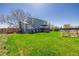 Expansive backyard with deck, lush green lawn, perfect for outdoor entertaining and relaxation at 4465 E 121St Pl, Thornton, CO 80241
