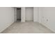 Spacious basement featuring a concrete floor, white walls, and access to closet space at 4465 E 121St Pl, Thornton, CO 80241