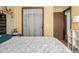 This bedroom features a large window with a lace curtain, and is painted a warm, neutral color at 4465 E 121St Pl, Thornton, CO 80241