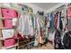 Walk-in closet with ample storage space, including shelves for shoes and folded clothing at 4465 E 121St Pl, Thornton, CO 80241