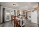 Open kitchen featuring wood cabinets, granite countertops, a center island, and stainless steel appliances at 4465 E 121St Pl, Thornton, CO 80241