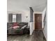 Inviting living room with stylish gray walls, dark floors, and natural light with stairs nearby at 4465 E 121St Pl, Thornton, CO 80241