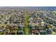 An aerial view of a vibrant neighborhood with tree-lined streets and green spaces at 4465 E 121St Pl, Thornton, CO 80241