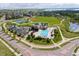 Aerial view of community amenities, pool, park, baseball field, tennis courts, and parking at 13561 W 87Th Dr, Arvada, CO 80005