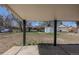 Large, fenced backyard featuring a shed and a covered patio, perfect for outdoor living at 1675 N Wabash St, Denver, CO 80220