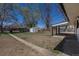 View of the expansive backyard with a shed and patio, offering ample space for outdoor activities at 1675 N Wabash St, Denver, CO 80220