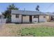 Charming home with a covered patio overlooking the fenced backyard, offering privacy and space at 1675 N Wabash St, Denver, CO 80220