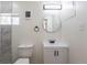 Bathroom features updated vanity and marble-look tiled shower at 1675 N Wabash St, Denver, CO 80220