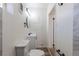 Bathroom features updated vanity and marble-look tiled shower at 1675 N Wabash St, Denver, CO 80220