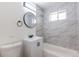 Modern bathroom with stylish tile, updated vanity, and sleek fixtures at 1675 N Wabash St, Denver, CO 80220