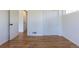 Bedroom with hardwood floors, closet and door leading to the hallway at 1675 N Wabash St, Denver, CO 80220
