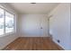Cozy bedroom featuring hardwood floors, a large window, and neutral wall paint at 1675 N Wabash St, Denver, CO 80220