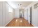 The bedroom features stylish wood-paneled walls, a large window, and beautiful wood floors at 1675 N Wabash St, Denver, CO 80220