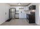 Modern kitchen with stainless appliances, white cabinets and subway tile backsplash at 1675 N Wabash St, Denver, CO 80220