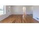 Bright living room featuring newly refinished hardwood floors and an open floor plan at 1675 N Wabash St, Denver, CO 80220