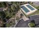 Aerial view showcasing the community playground, tennis courts, and parking area at 24714 E Quarto Pl, Aurora, CO 80016