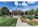 Charming clubhouse with stone accents and covered porch, nestled in beautifully landscaped grounds at 24714 E Quarto Pl, Aurora, CO 80016