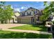 Inviting two-story home featuring a well-manicured lawn and a convenient two-car garage at 24714 E Quarto Pl, Aurora, CO 80016