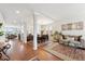 Spacious living area showcasing an open floor plan with seamless transitions between the dining and living spaces at 24714 E Quarto Pl, Aurora, CO 80016