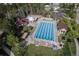 Large community swimming pool with lounge chairs and shaded areas for relaxation at 24714 E Quarto Pl, Aurora, CO 80016
