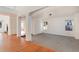 Bright living room with hardwood floors and a view into another room at 5294 S Espana St, Centennial, CO 80015