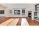 Living room with hardwood floors, fireplace, and large windows at 5294 S Espana St, Centennial, CO 80015