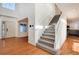 Interior view of a staircase with hardwood floors and white railings at 5294 S Espana St, Centennial, CO 80015