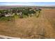 Panoramic aerial shot of the home site surrounded by mature trees and long open fields at 5861 E Valley Hi Dr, Parker, CO 80138