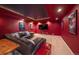 Home theater features a large sectional sofa and a movie-themed decor at 5861 E Valley Hi Dr, Parker, CO 80138