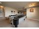 Basement area features a pool table, bar and ample seating at 5861 E Valley Hi Dr, Parker, CO 80138