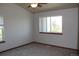 Bright bedroom with large windows, neutral carpeting, and a ceiling fan for comfortable living at 5861 E Valley Hi Dr, Parker, CO 80138