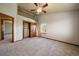 Well-lit bedroom with a loft, spacious closet, and a window providing natural light at 5861 E Valley Hi Dr, Parker, CO 80138