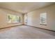 Bright bedroom with neutral walls, large windows, and cozy carpeting at 5861 E Valley Hi Dr, Parker, CO 80138