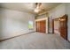 Unique bedroom featuring a ceiling fan, a loft, and ample closet space at 5861 E Valley Hi Dr, Parker, CO 80138