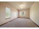 Spacious bedroom with large windows, neutral walls, and a modern ceiling light at 5861 E Valley Hi Dr, Parker, CO 80138
