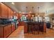 Beautiful kitchen with wood cabinetry, stainless steel appliances, and a central island at 5861 E Valley Hi Dr, Parker, CO 80138