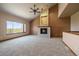 Cozy living room with a vaulted ceiling, fireplace, and a large window with a scenic view at 5861 E Valley Hi Dr, Parker, CO 80138