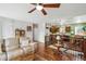 Living room leading to the kitchen and dining area, showcasing an open floor plan at 7472 Jay Ct, Arvada, CO 80003