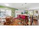 Bright living space featuring a kitchen bar, dining area, and living room access at 7472 Jay Ct, Arvada, CO 80003