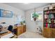 Office space with wood desk, large map, and built-in shelving, perfect for working from home at 7472 Jay Ct, Arvada, CO 80003