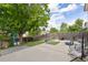 Backyard features a spacious patio, mature trees, and privacy fence at 5831 W 108Th Pl, Westminster, CO 80020