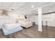 Spacious basement bedroom features two beds, white cabinets, and plank flooring at 5831 W 108Th Pl, Westminster, CO 80020