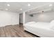 Basement bedroom with plank flooring, white walls, and recessed lighting at 5831 W 108Th Pl, Westminster, CO 80020