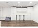 Finished basement includes storage cabinets, workstation, and plank flooring at 5831 W 108Th Pl, Westminster, CO 80020