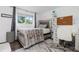 Stylish bedroom with gray decor, desk, chair, and shelves at 5831 W 108Th Pl, Westminster, CO 80020