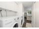 Convenient laundry room featuring modern appliances and ample storage space at 5831 W 108Th Pl, Westminster, CO 80020