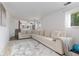 Spacious living room featuring a large sectional couch and a decorative rug at 5831 W 108Th Pl, Westminster, CO 80020